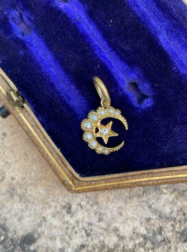Here’s the product description for the Tiny 15ct Gold Crescent Charm with Diamond & Seed Pearl: Tiny 15ct Gold Crescent Charm with Diamond & Seed Pearl
